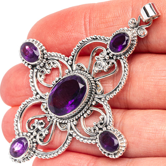 Signature amethyst cross pendant in .925 sterling silver with purple oval gemstones