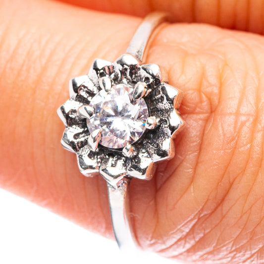 Sterling silver cubic zirconia ring with round center stone, halo-like prongs