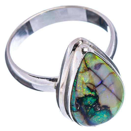 Silver opal ring with teardrop bezel-set gemstone in green-blue iridescent pattern