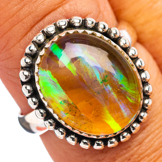 Sterling silver opal ring with oval rainbow stone and beaded bezel