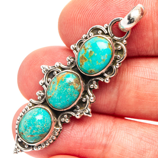 Turquoise pendant with three oval stones in .925 sterling silver ornate frame.