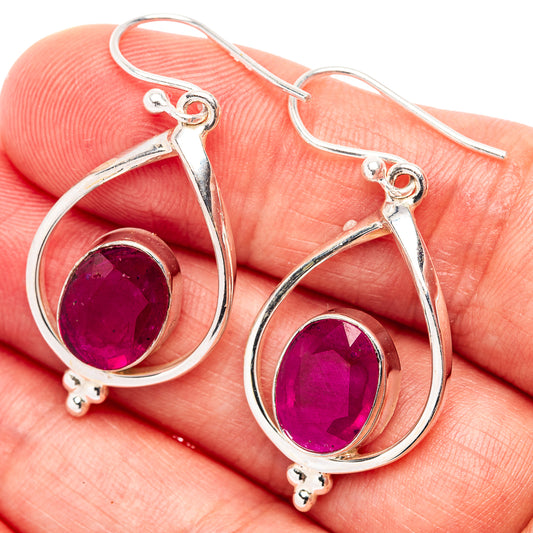 Sterling silver teardrop ruby earrings with oval purple gemstone drops and French hooks