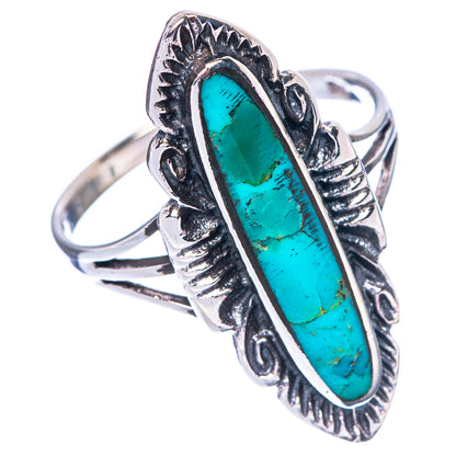 Oval turquoise cabochon ring in sterling silver, raised border and carved shank