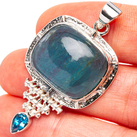 Sterling silver pendant with dark blue oval center stone and blue teardrop accent