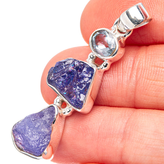 Sterling silver pendant with round blue topaz and two purple tanzanite rough stones