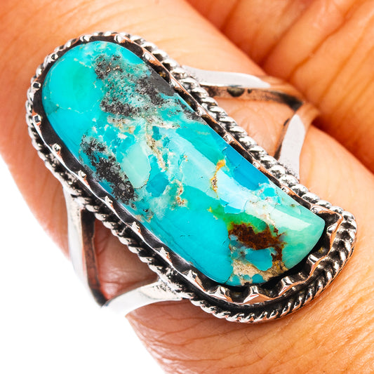 Turquoise inlay oval gemstone ring with braided silver bezel, silver band visible