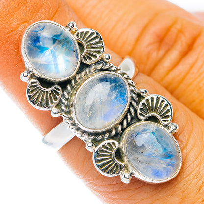 Sterling silver ring with three oval moonstone cabochons and petal settings