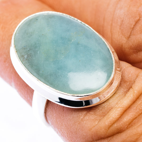 Oval aquamarine cabochon sterling silver ring with polished bezel