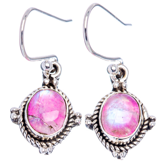 Pink oval moonstone earrings with sterling silver lever hooks and bead-textured settings.