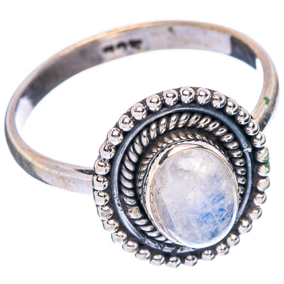 Sterling silver band ring with oval moonstone cabochon, engraved swirl and bead rim