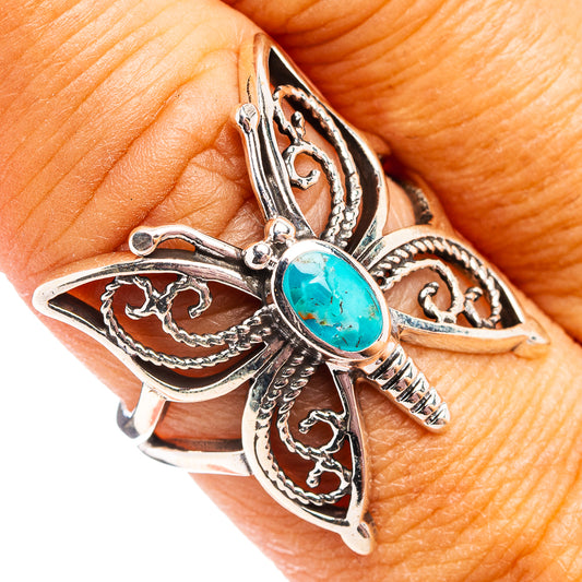 Turquoise butterfly sterling silver ring with oval turquoise center, detailed filigree