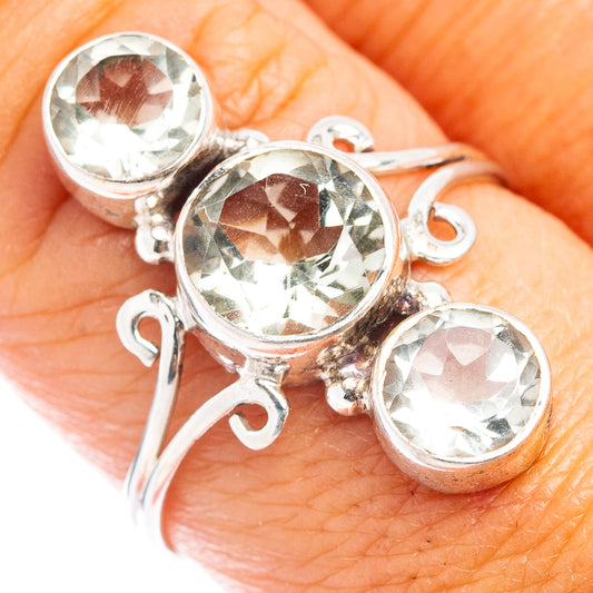 Sterling silver ring with three round faceted gemstones