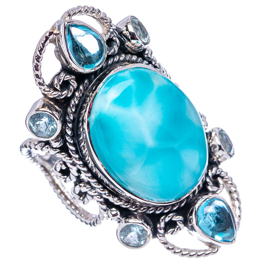 Sterling silver ring with large oval turquoise center stone and small blue round stones