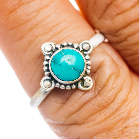Turquoise cabochon sterling silver ring with ornate bezel and bead accents