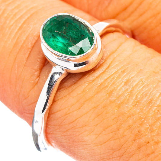 Sterling silver ring with oval green emerald gemstone, polished band