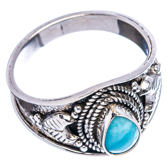 Sterling silver cocktail ring side view with oval light blue larimar and detailed beadwork