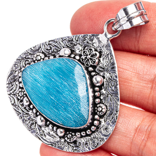 German silver pendant with blue oval center, beaded edge, and top bail loop