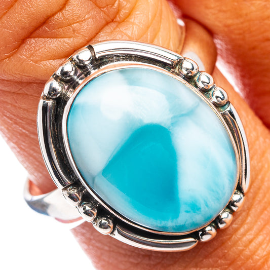 Sterling silver oval larimar ring with blue stone, scalloped bezel and side prongs