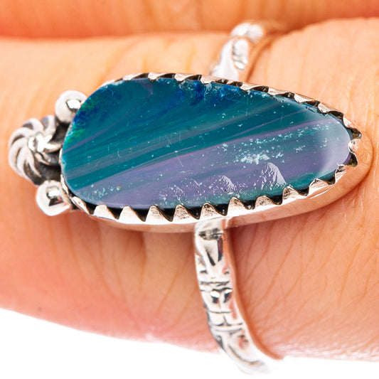 Sterling silver opal doublet ring with blue oval doublet stone and serrated prong bezel
