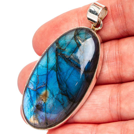 Oval labradorite pendant with blue flashes in .925 sterling silver frame, bail top
