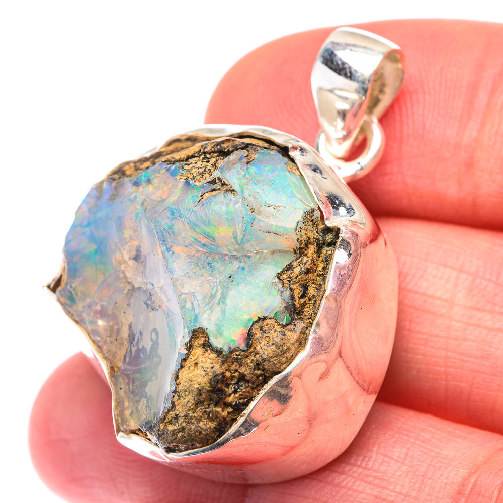 Rough opal pendant, 925 sterling silver bezel with blue-green iridescence and gold matrix