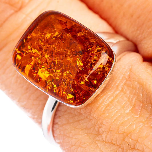 Baltic amber oval cabochon ring in .925 sterling silver, polished band.