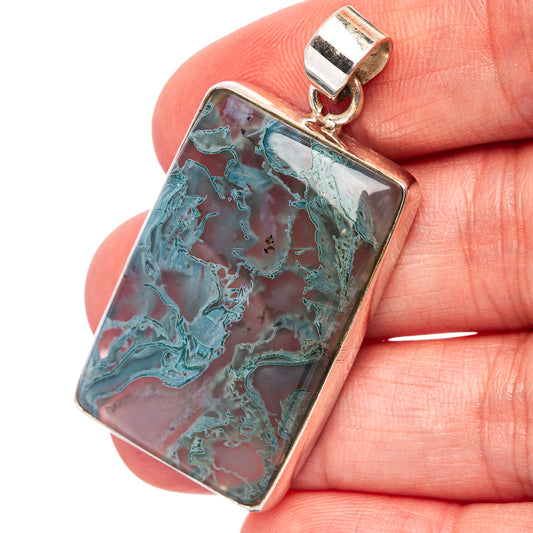 Sterling silver rectangular moss agate pendant with teal and green swirled pattern