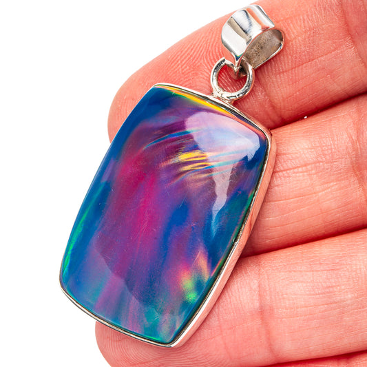 Iridescent opal pendant with .925 sterling silver bail and silver bezel frame