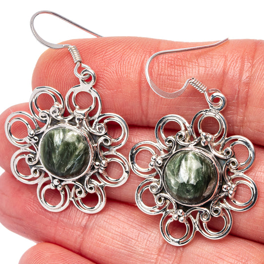 Ornate .925 sterling silver drop earrings with round green seraphinite cabochon