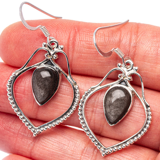 Sterling silver drop earrings with dark pear cabochon; beaded frame on hook