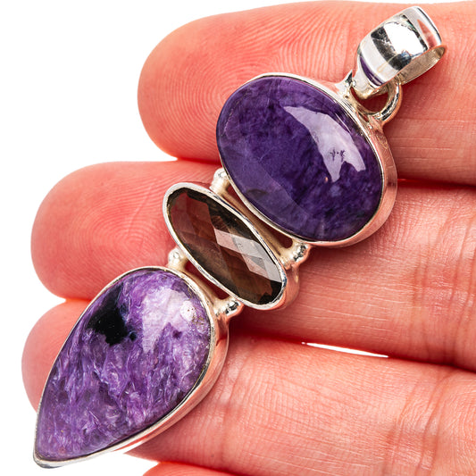 Oval purple charoite and smoky quartz pendant in polished .925 sterling silver setting