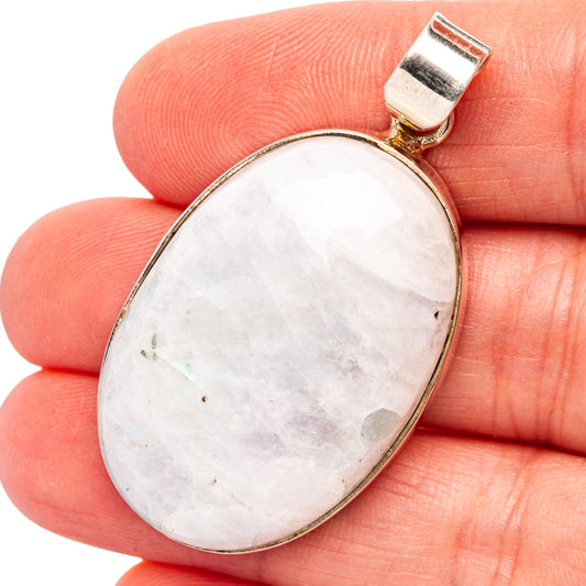 Oval rainbow moonstone pendant in .925 sterling silver bezel with hinged bail