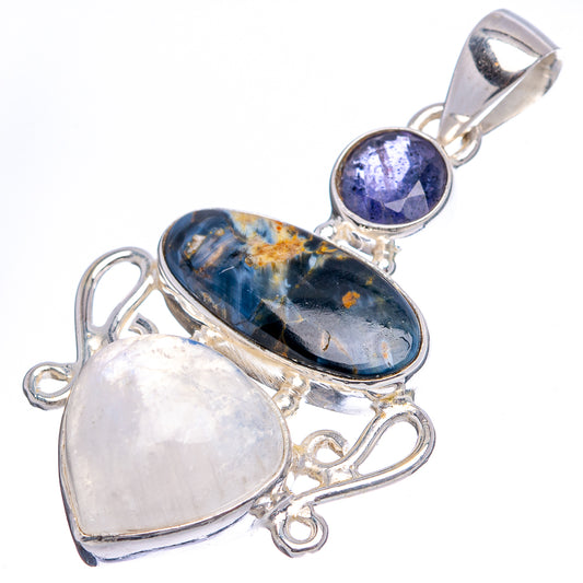 Sterling silver pendant with oval blue stone, round purple cabochon, and pale moonstone