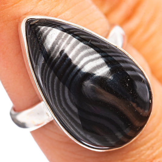 Sterling silver ring with black teardrop striped cabochon on open band
