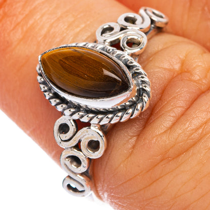Sterling silver dainty ring with oval tiger eye cabochon and ornate bezel, size 6.75