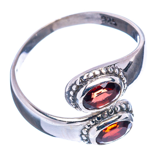 Sterling silver ring with two oval garnet-red stones and filigree side setting