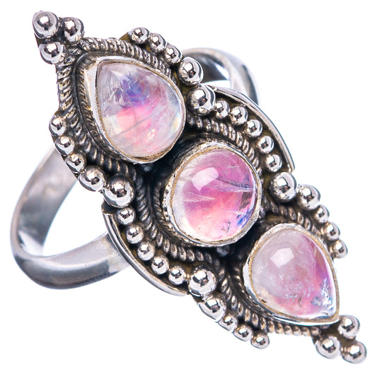 Sterling silver ring with three oval pink opal-like stones, side view showing scalloped bezel