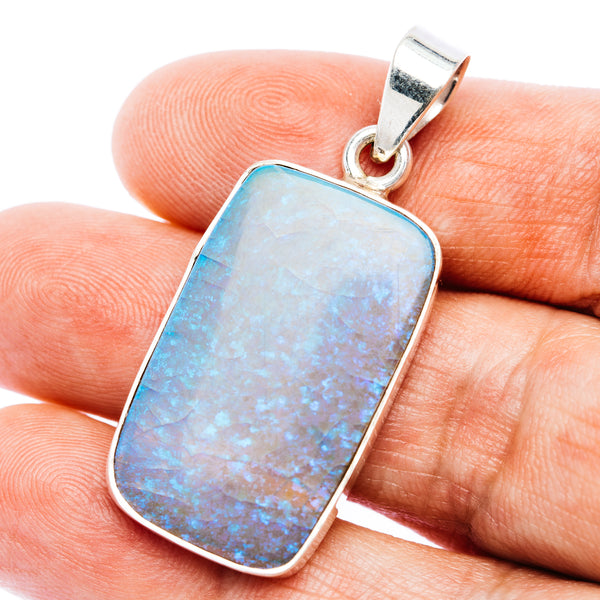 Sterling silver opal pendant with rectangular blue-white opal center and loop bail