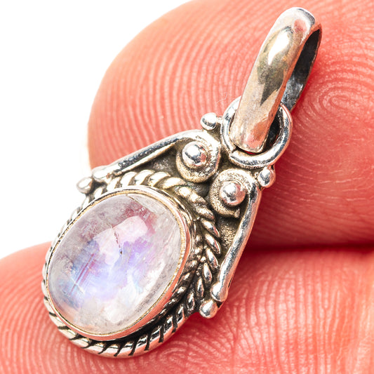 Sterling silver moonstone pendant with oval rainbow stone and ornate bezel