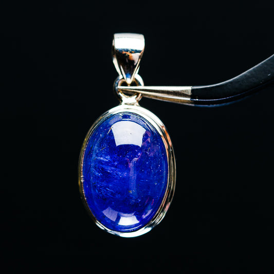 Oval tanzanite pendant in .925 sterling silver bezel with polished bail, blue gemstone