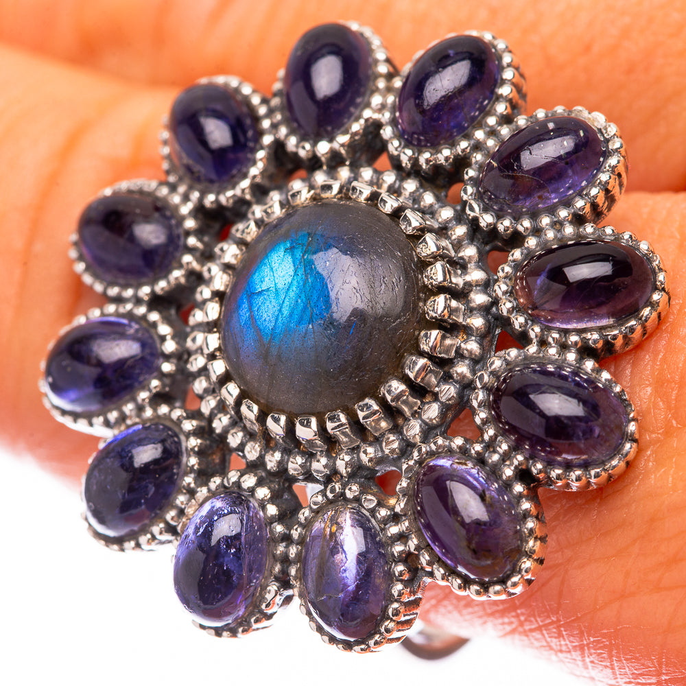 Sterling silver ring with glowing labradorite center, purple-blue oval gemstones