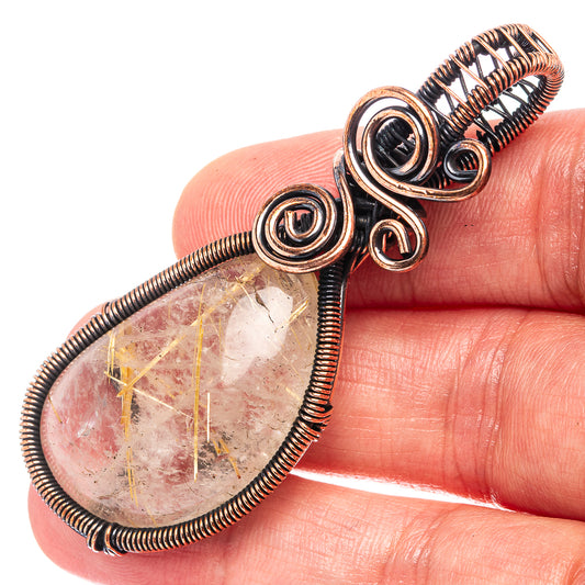 Oxidized copper wire-wrapped teardrop quartz pendant, spiral bail and gold veins
