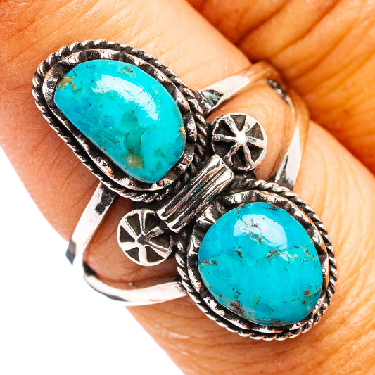 Turquoise sterling silver ring with two oval stones, rope bezels, floral cutouts