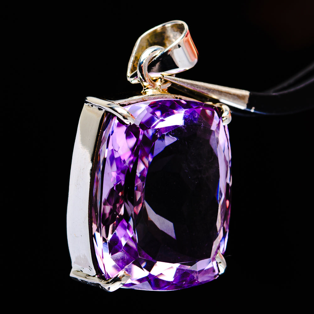 Sterling silver amethyst pendant, angled view of faceted purple cushion-cut stone