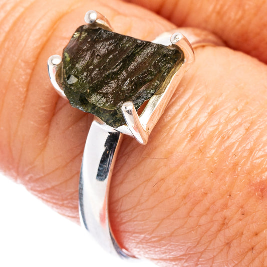 Sterling silver moldavite ring with dark green rough stone and V-shaped prong setting