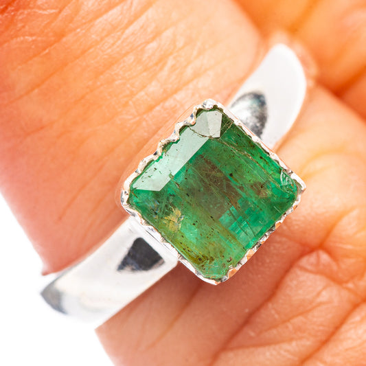 Sterling silver ring with square faceted green gemstone in bezel setting