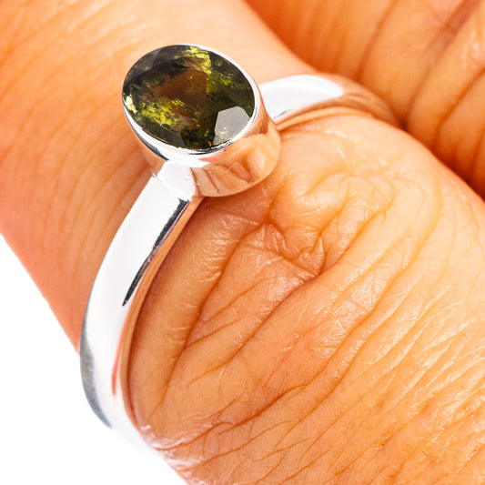 Sterling silver moldavite ring with dark green faceted gemstone bezel