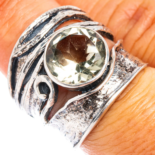 Sterling silver ring with oval green amethyst center stone and decorative bezel