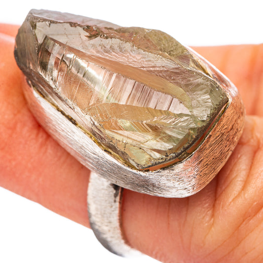 Raw amethyst ring with textured .925 sterling silver band and faceted raw stone top.
