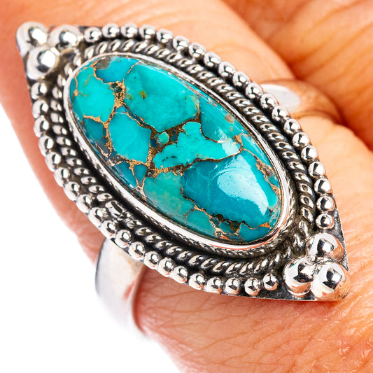 Sterling silver size 8.5 ring on hand, oval turquoise cabochon with beaded silver border